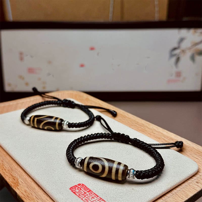 Bracelet en corde de protection de richesse Buddha Stones tibétaines à neuf yeux et à trois yeux