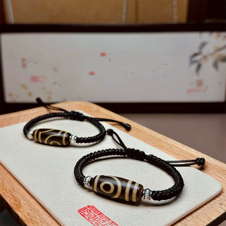 Bracelet en corde de protection de richesse Buddha Stones tibétaines à neuf yeux et à trois yeux