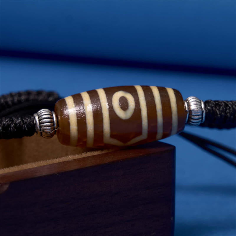 Bracelet en corde de protection de richesse Buddha Stones tibétaines à neuf yeux et à trois yeux