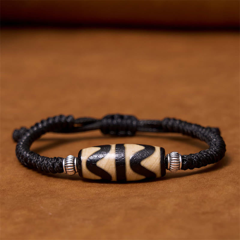 Bracelet en corde de protection de richesse Buddha Stones tibétaines à neuf yeux et à trois yeux