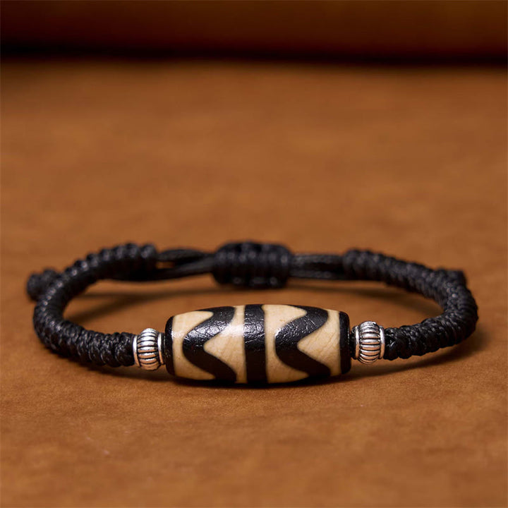 Bracelet en corde de protection de richesse Buddha Stones tibétaines à neuf yeux et à trois yeux