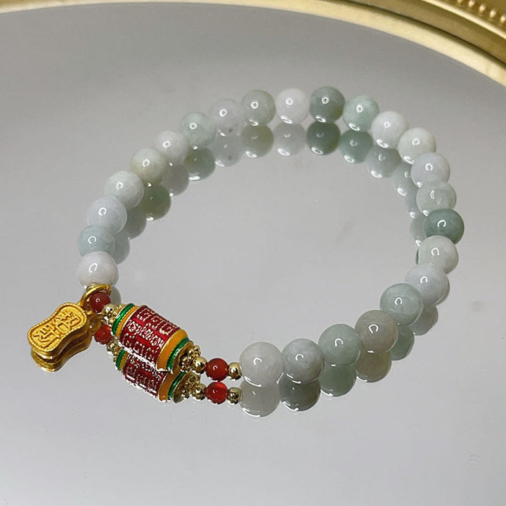 Bracelet tibétain en jade naturel avec Buddha Stones et roue de prières avec personnage Fu pour la prospérité et l'abondance