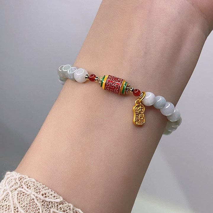 Bracelet tibétain en jade naturel avec Buddha Stones et roue de prières avec personnage Fu pour la prospérité et l'abondance