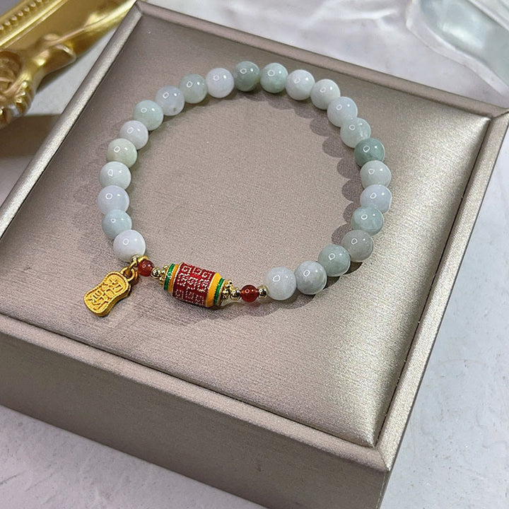 Bracelet tibétain en jade naturel avec Buddha Stones et roue de prières avec personnage Fu pour la prospérité et l'abondance