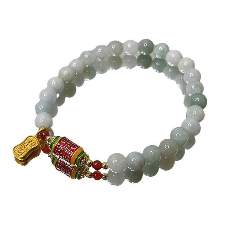 Bracelet tibétain en jade naturel avec Buddha Stones et roue de prières avec personnage Fu pour la prospérité et l'abondance