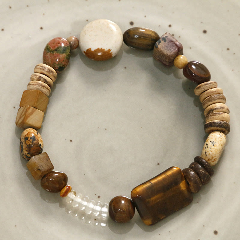 Bracelet courage en coquille de noix de coco et œil de tigre avec Buddha Stones