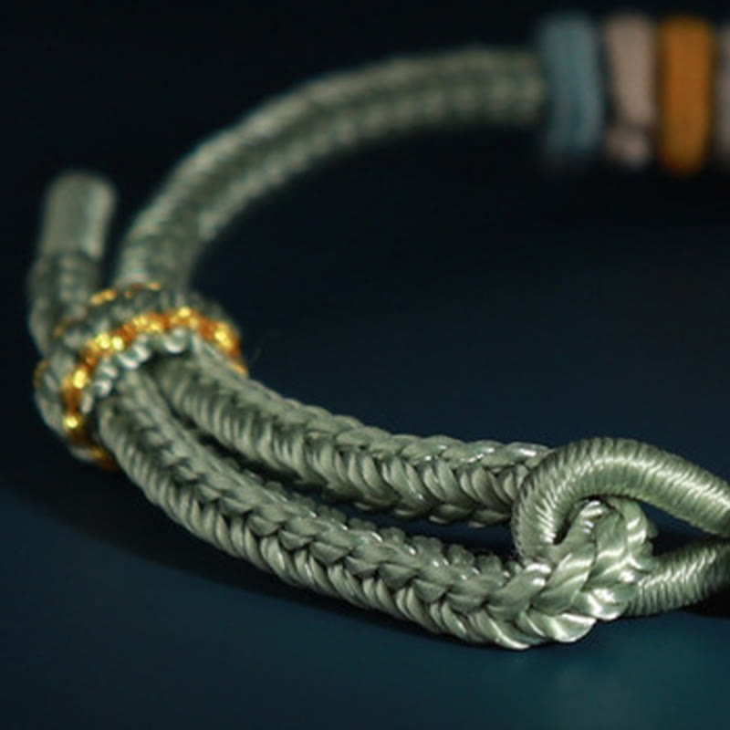 Bracelet de connexion en fleur de pêcher avec quatre Buddha Stones