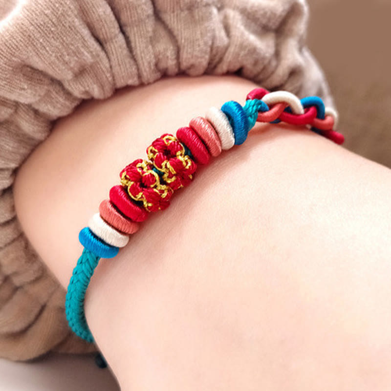 Bracelet de connexion en fleur de pêcher avec quatre Buddha Stones