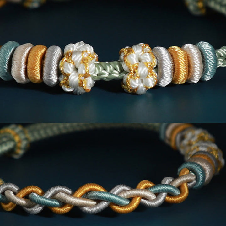 Bracelet de connexion en fleur de pêcher avec quatre Buddha Stones