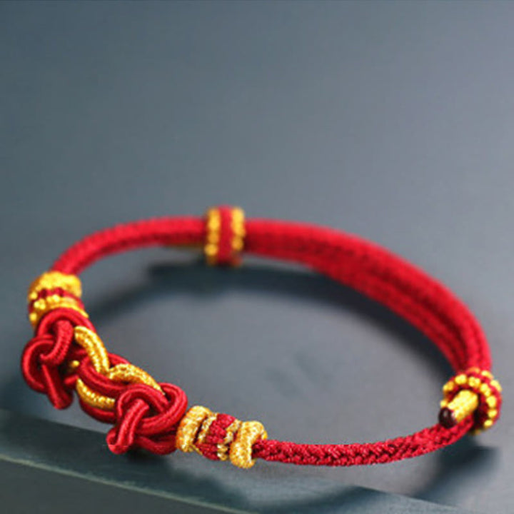 Bracelet de force en corde rouge avec nœud de selle et Buddha Stones