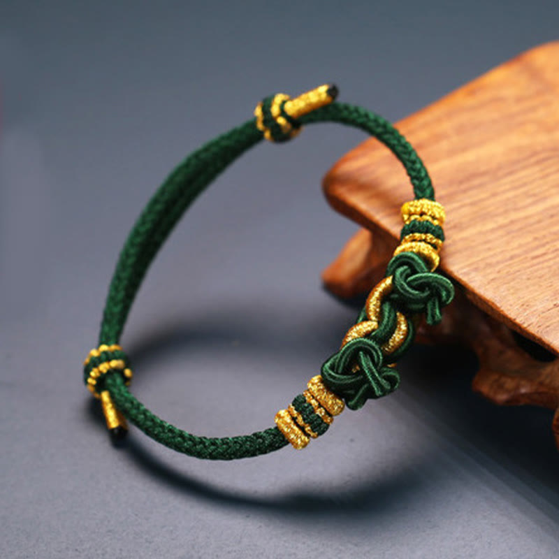 Bracelet de force en corde rouge avec nœud de selle et Buddha Stones