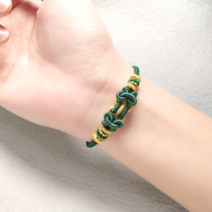 Bracelet de force en corde rouge avec nœud de selle et Buddha Stones