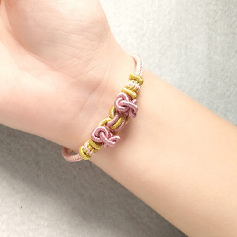 Bracelet de force en corde rouge avec nœud de selle et Buddha Stones