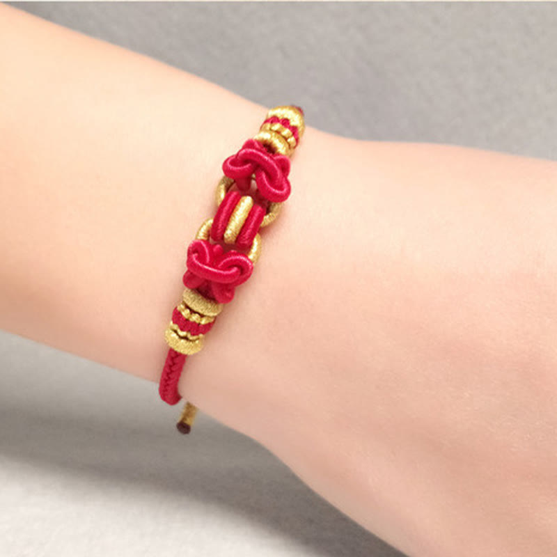 Bracelet de force en corde rouge avec nœud de selle et Buddha Stones