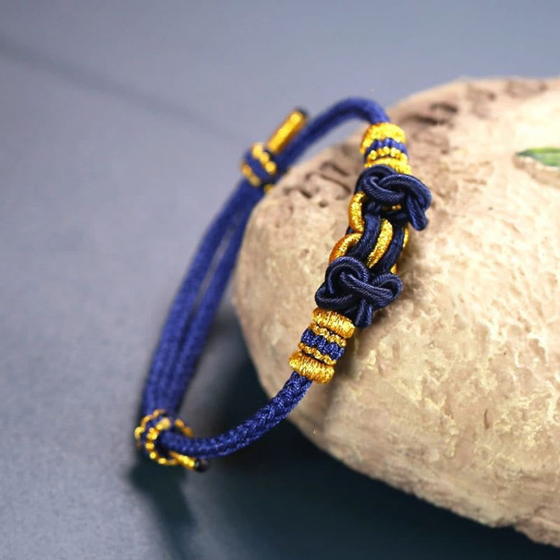 Bracelet de force en corde rouge avec nœud de selle et Buddha Stones