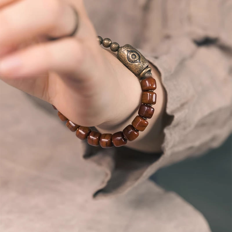 Bracelet de force avec pendentif en forme de cône en cuivre en forme de Dzi en Buddha Stones