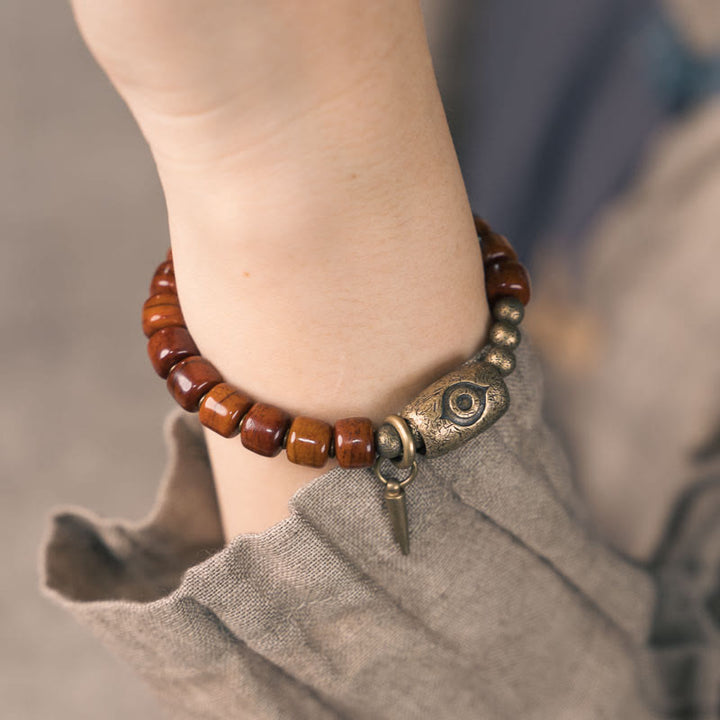 Bracelet de force avec pendentif en forme de cône en cuivre en forme de Dzi en Buddha Stones