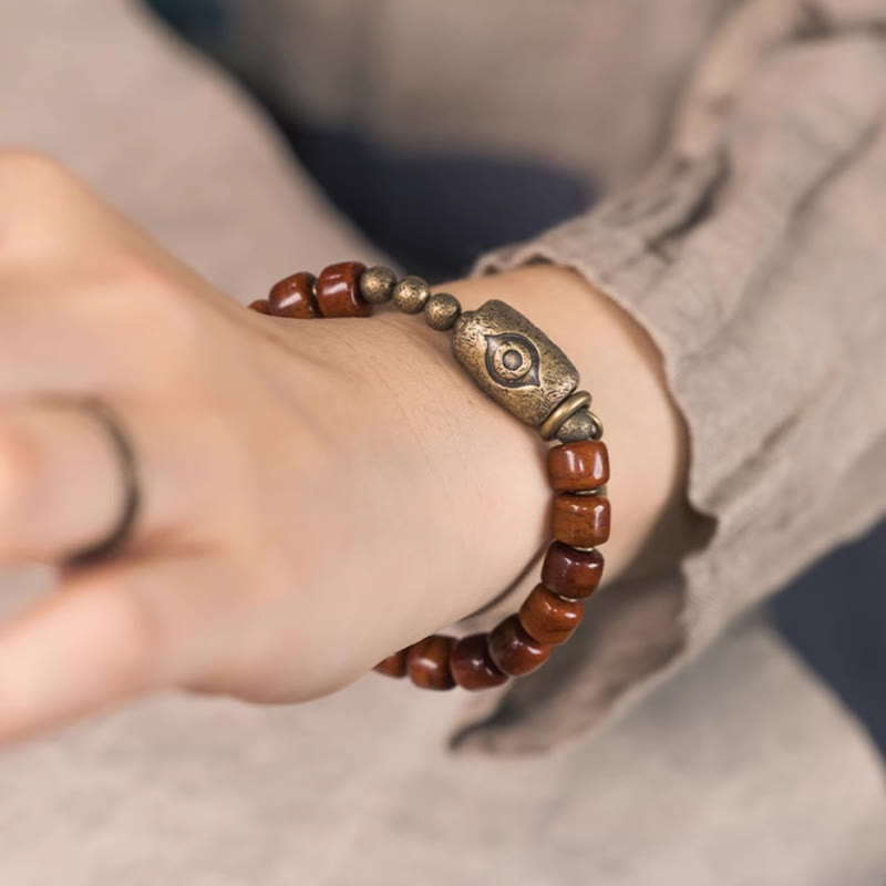 Bracelet de force avec pendentif en forme de cône en cuivre en forme de Dzi en Buddha Stones