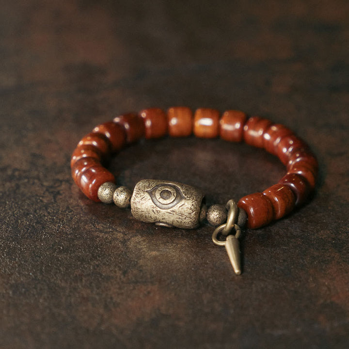 Bracelet de force avec pendentif en forme de cône en cuivre en forme de Dzi en Buddha Stones