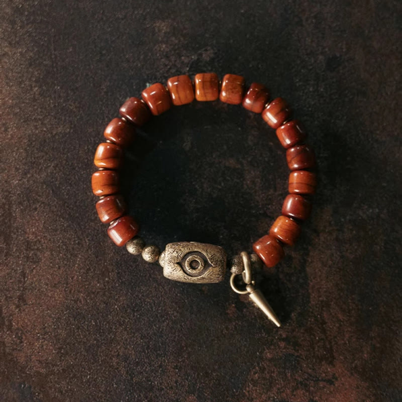 Bracelet de force avec pendentif en forme de cône en cuivre en forme de Dzi en Buddha Stones