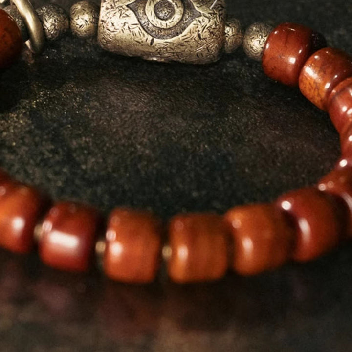 Bracelet de force avec pendentif en forme de cône en cuivre en forme de Dzi en Buddha Stones