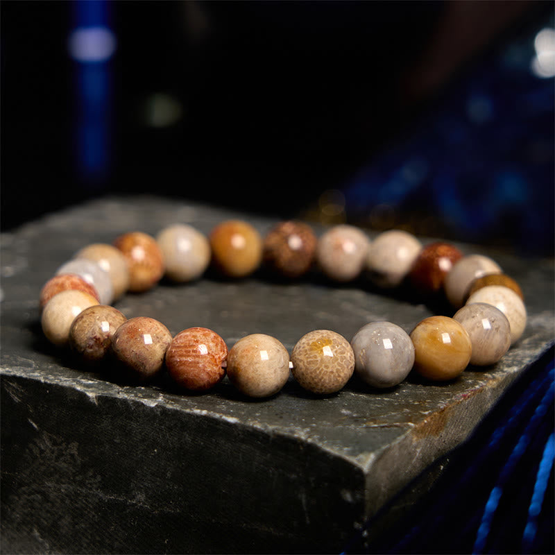 Bracelet de compassion en corail fossile Buddha Stones