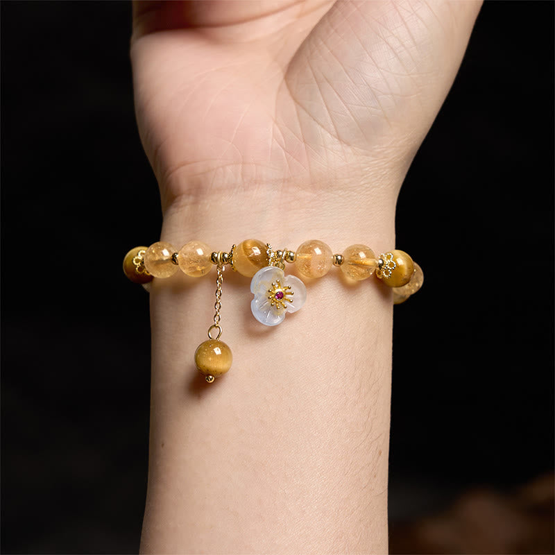 Bracelet de générosité avec breloque fleur œil de tigre et citrine en Buddha Stones