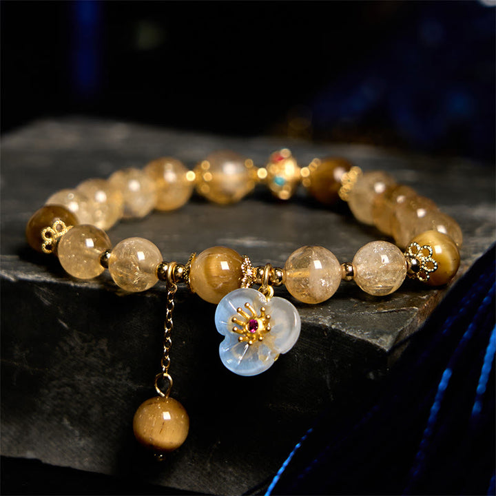 Bracelet de générosité avec breloque fleur œil de tigre et citrine en Buddha Stones