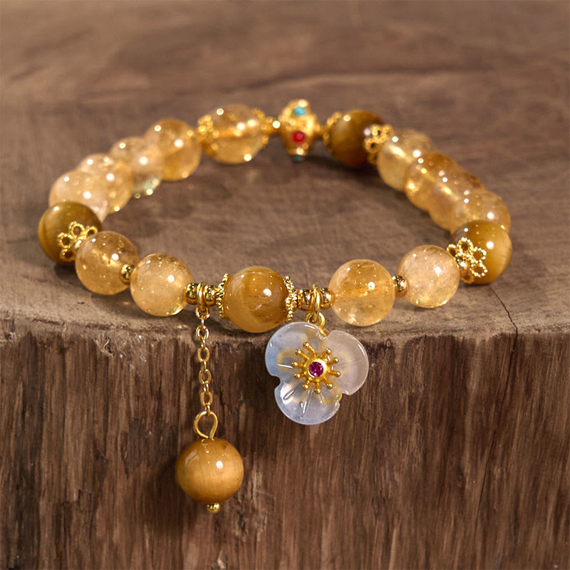 Bracelet de générosité avec breloque fleur œil de tigre et citrine en Buddha Stones