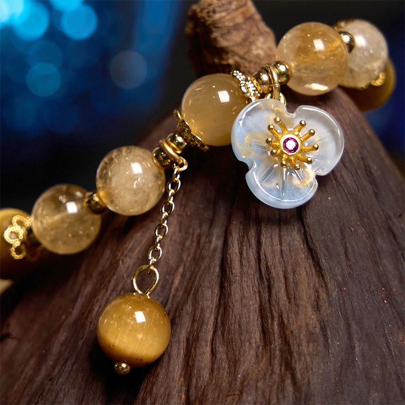 Bracelet de générosité avec breloque fleur œil de tigre et citrine en Buddha Stones