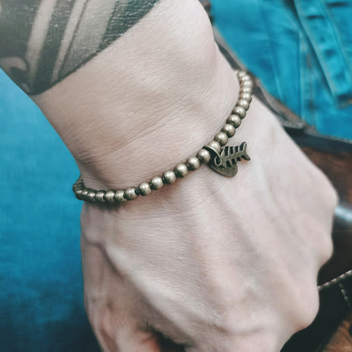 Bracelet de guérison en arête de poisson en cuivre et Buddha Stones