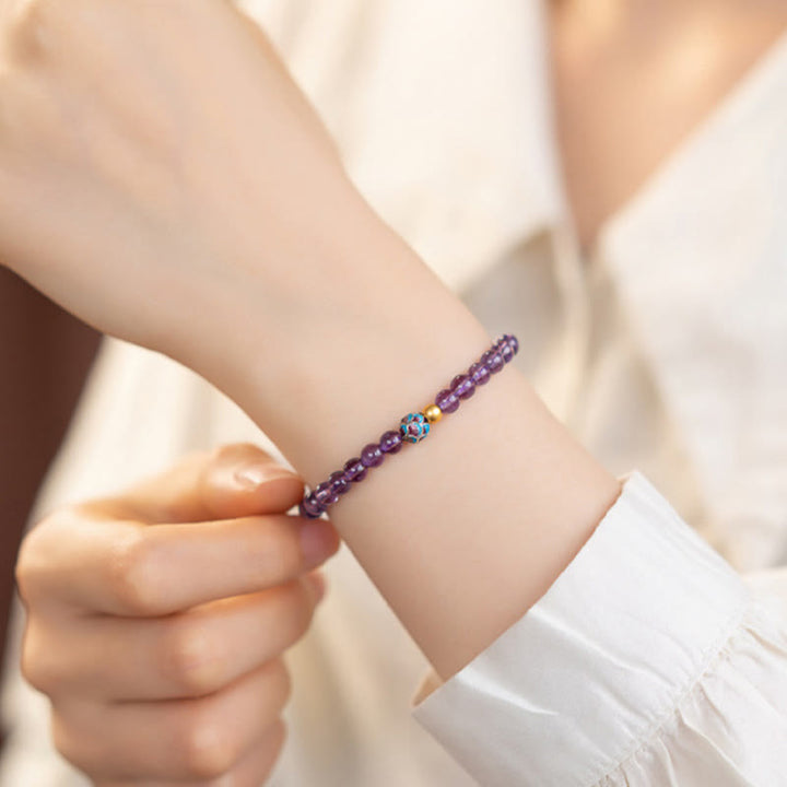 Bracelet de conscience spirituelle en améthyste naturelle et lotus de Buddha Stones