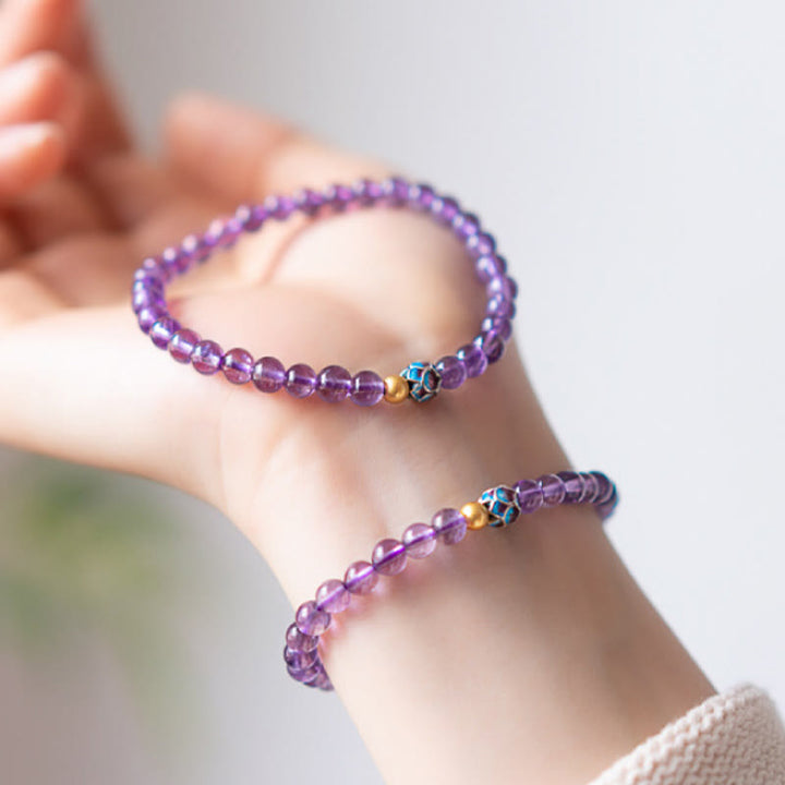 Bracelet de conscience spirituelle en améthyste naturelle et lotus de Buddha Stones