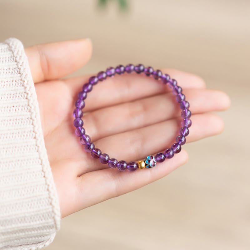 Bracelet de conscience spirituelle en améthyste naturelle et lotus de Buddha Stones