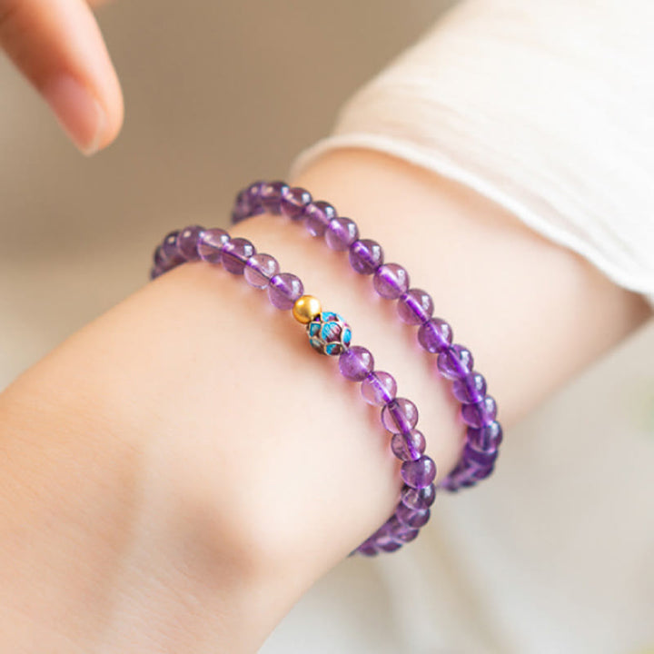 Bracelet de conscience spirituelle en améthyste naturelle et lotus de Buddha Stones