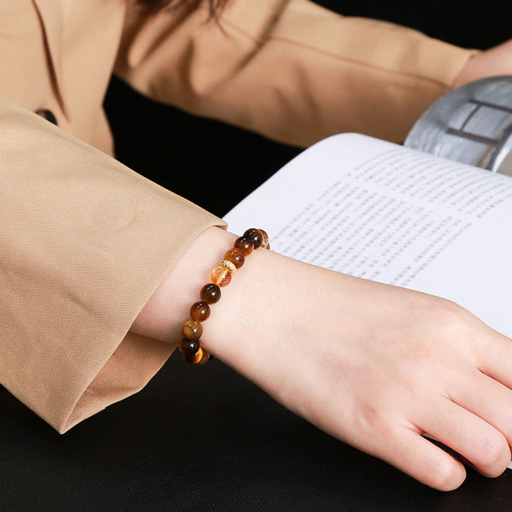 Bracelet de force en perles naturelles œil de tigre et citrine avec Buddha Stones