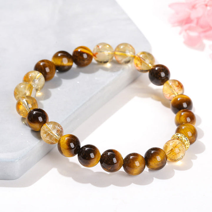 Bracelet de force en perles naturelles œil de tigre et citrine avec Buddha Stones