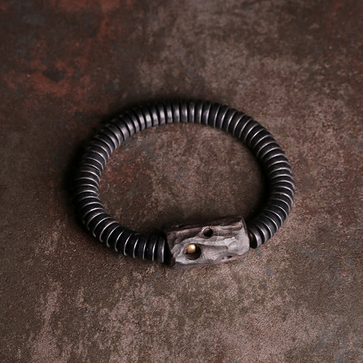 Bracelet d'équilibre troué en bois d'ébène et cuivre et laiton avec Buddha Stones