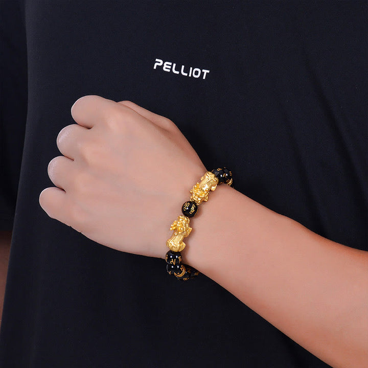 Bracelet de force en Buddha Stones en obsidienne noire et onyx noir en alliage doré à deux PiXiu Om Mani Padme Hum