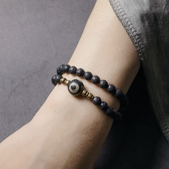 Bracelet de guérison à double tour en perles de cuivre et de laiton avec Buddha Stones de lave vintage à trois yeux Dzi