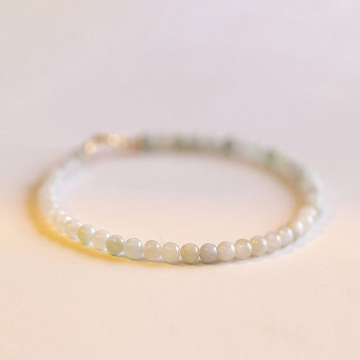 Bracelet porte-bonheur en cuivre plaqué or 14 carats avec perles ultra-fines en jade de 2 mm et Buddha Stones