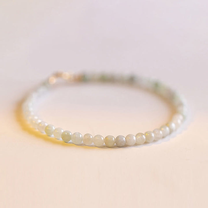 Bracelet porte-bonheur en cuivre plaqué or 14 carats avec perles ultra-fines en jade de 2 mm et Buddha Stones