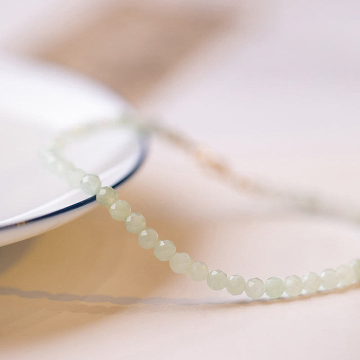 Bracelet porte-bonheur en cuivre plaqué or 14 carats avec perles ultra-fines en jade de 2 mm et Buddha Stones