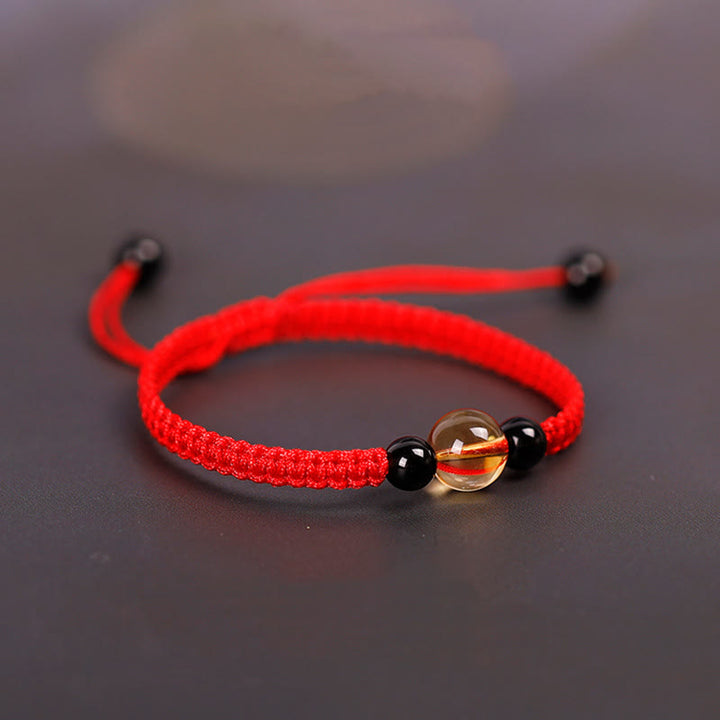 Bracelet en corde porte-bonheur avec nœud de paix et perles d'obsidienne noire en citrine fabriquées à la main par Buddha Stones