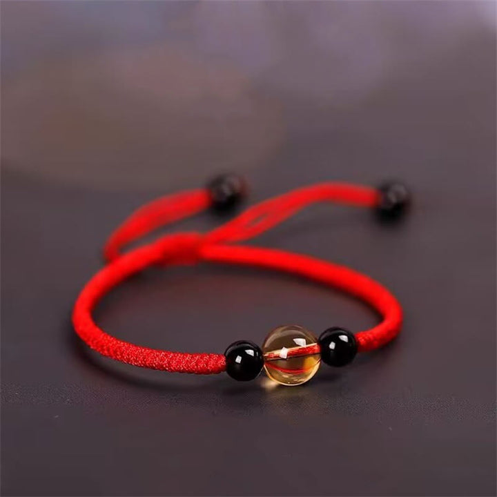 Bracelet en corde porte-bonheur avec nœud de paix et perles d'obsidienne noire en citrine fabriquées à la main par Buddha Stones