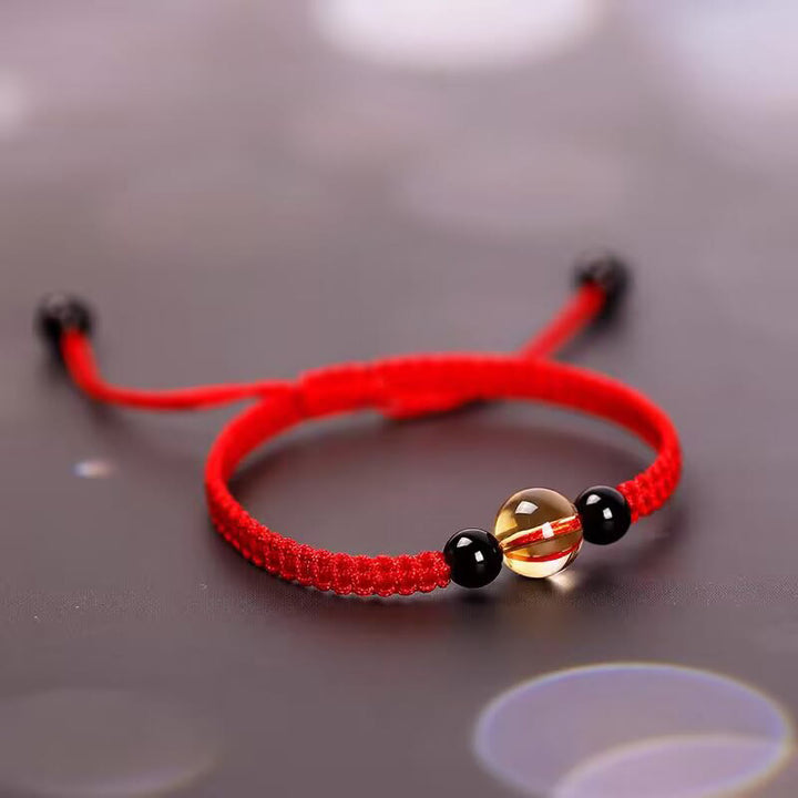 Bracelet en corde porte-bonheur avec nœud de paix et perles d'obsidienne noire en citrine fabriquées à la main par Buddha Stones
