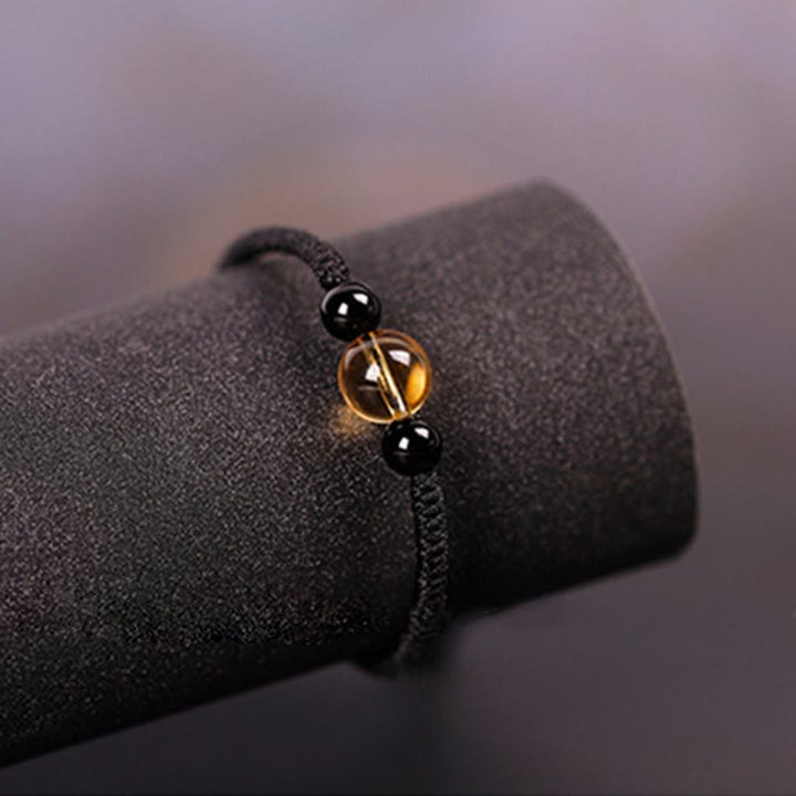 Bracelet en corde porte-bonheur avec nœud de paix et perles d'obsidienne noire en citrine fabriquées à la main par Buddha Stones
