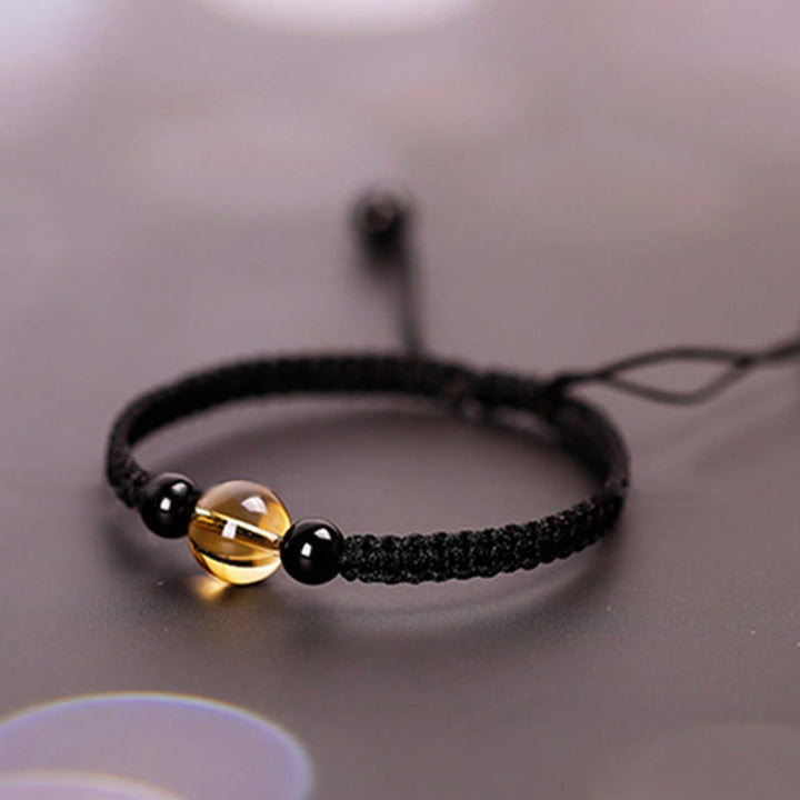Bracelet en corde porte-bonheur avec nœud de paix et perles d'obsidienne noire en citrine fabriquées à la main par Buddha Stones