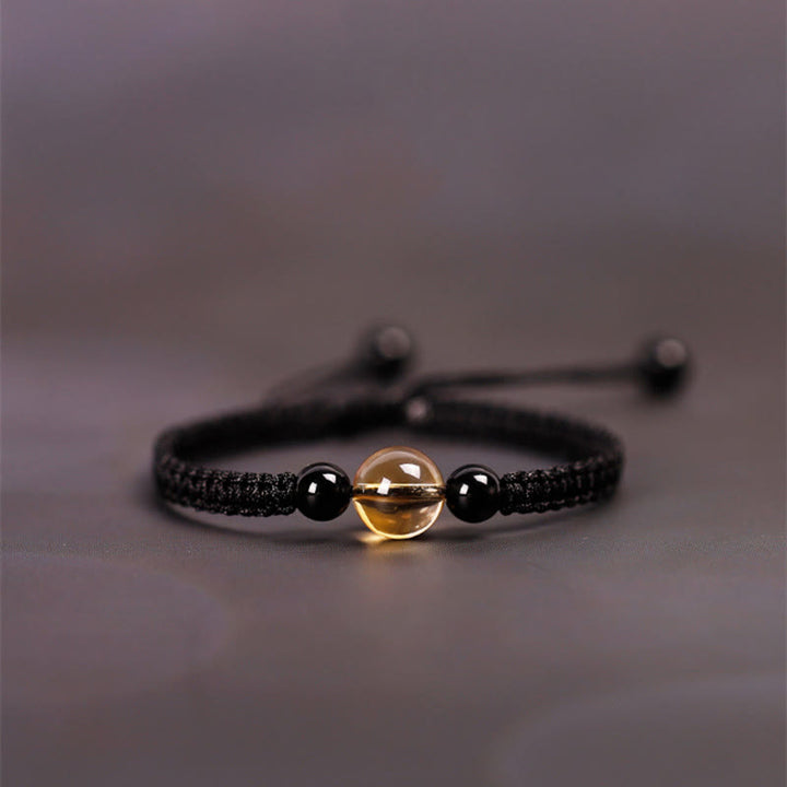 Bracelet en corde porte-bonheur avec nœud de paix et perles d'obsidienne noire en citrine fabriquées à la main par Buddha Stones