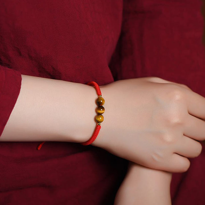 Bracelet en corde de protection porte-bonheur en perles d'œil de tigre faites à la main avec des Buddha Stones